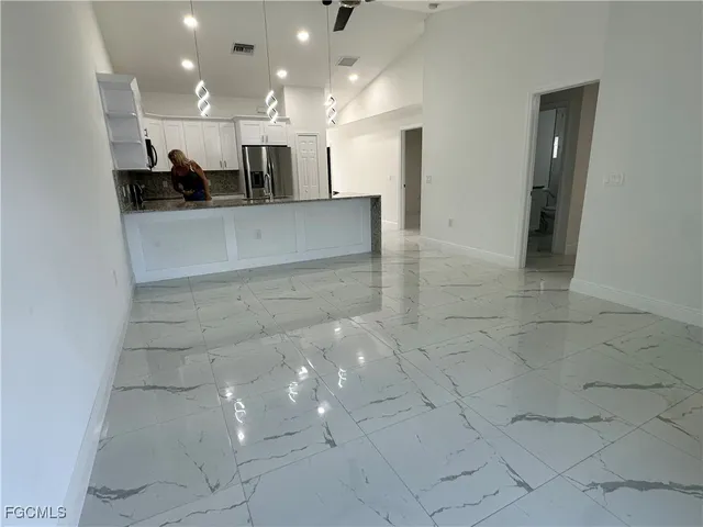 a view of a kitchen with a sink