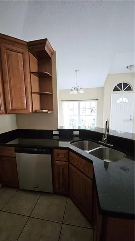 a kitchen with a sink and cabinets