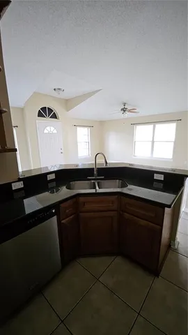a kitchen with a sink and cabinets
