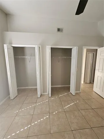 a view of a field with an trees in the background