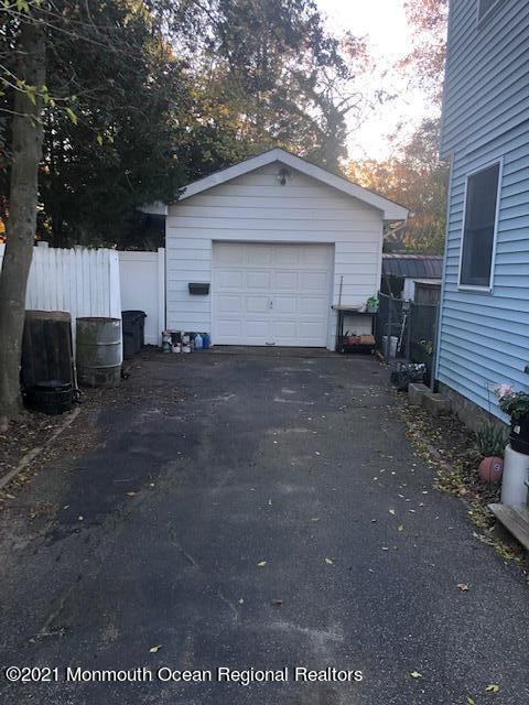 307 Sudbury Road Point Pleasant, NJ 08742 - Photo 14 of 19 a view of a house with a yard and tree