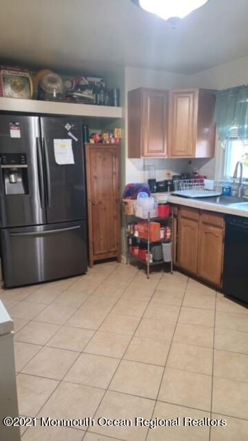307 Sudbury Road Point Pleasant, NJ 08742 - Photo 5 of 19 a kitchen with granite countertop a refrigerator and a stove top oven