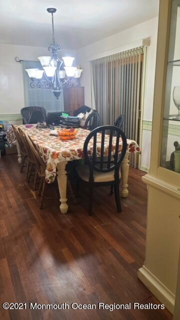 307 Sudbury Road Point Pleasant, NJ 08742 - Photo 9 of 19 a view of a dining room with furniture and wooden floor