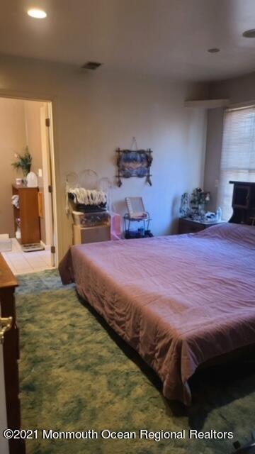 307 Sudbury Road Point Pleasant, NJ 08742 - Photo 10 of 19 a bedroom with a bed and a view of kitchen