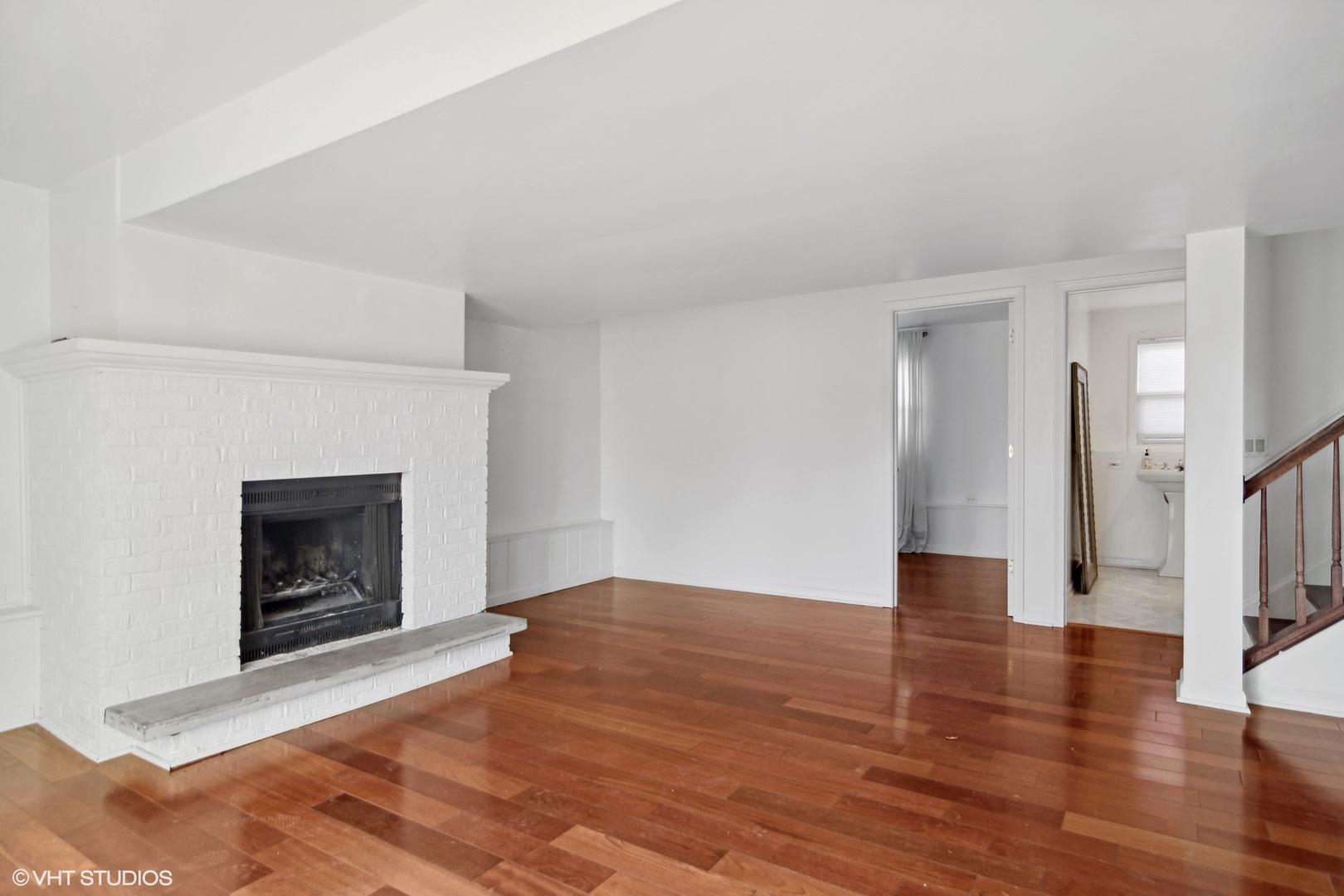 245 Thomas Street Cary, IL 60013 - Photo 12 of 28 a view of empty room with wooden floor and fireplace