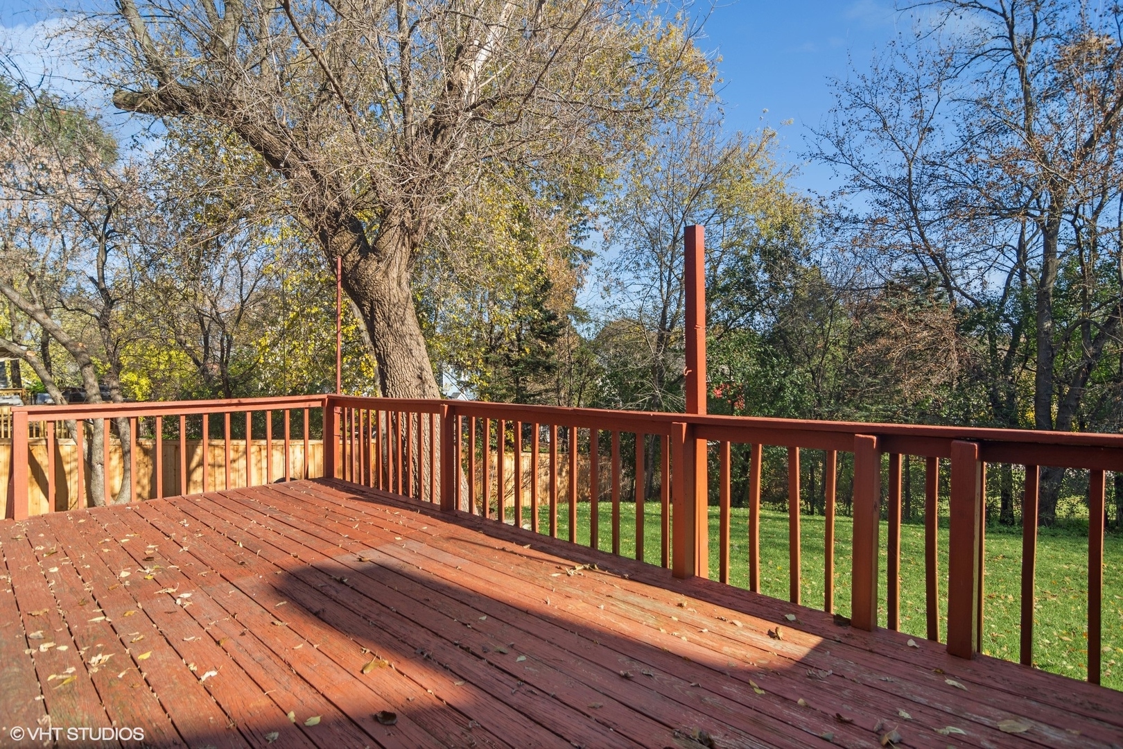 245 Thomas Street Cary, IL 60013 - Photo 18 of 28 a balcony with wooden floor and fence