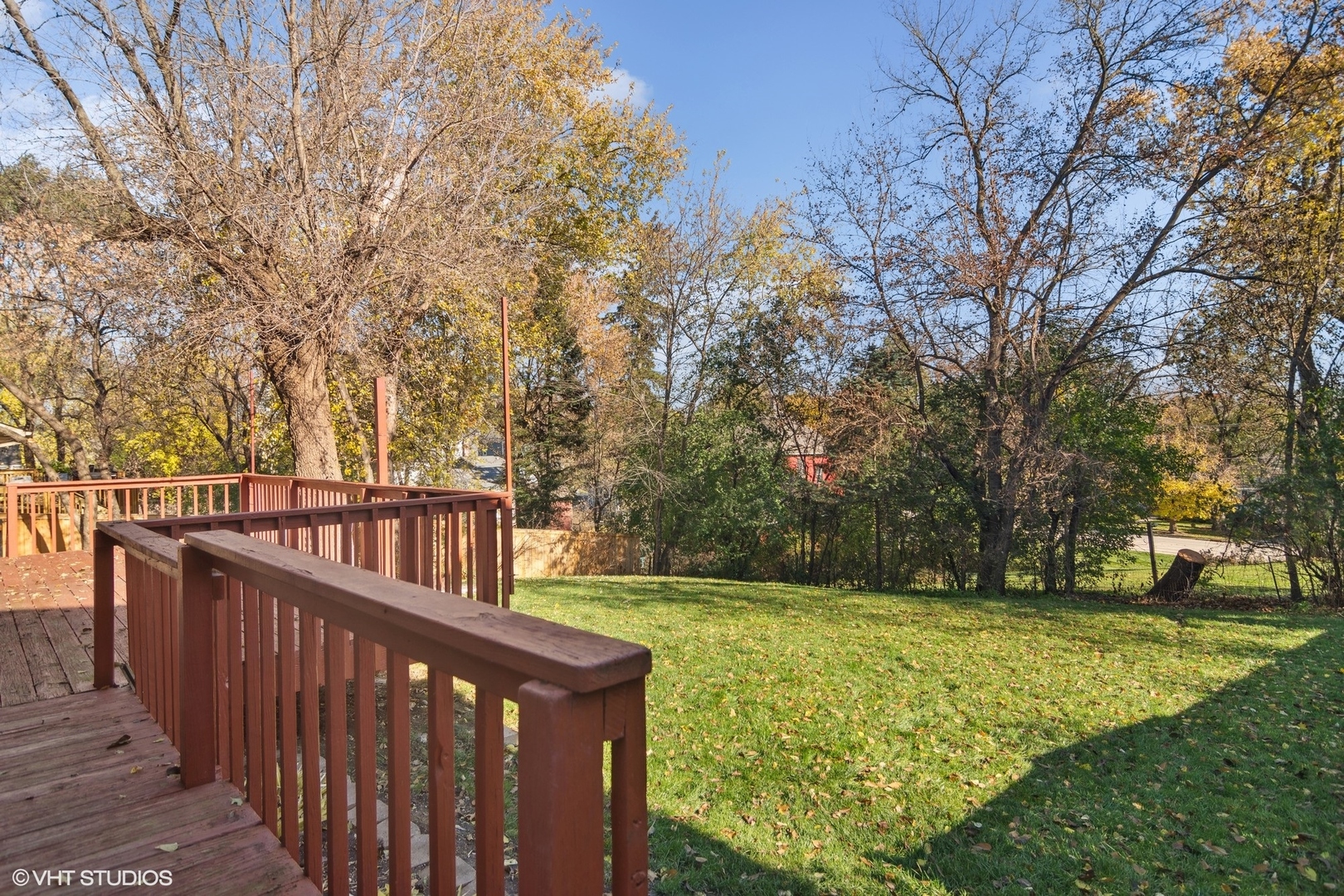 245 Thomas Street Cary, IL 60013 - Photo 19 of 28 a view of a deck with large trees