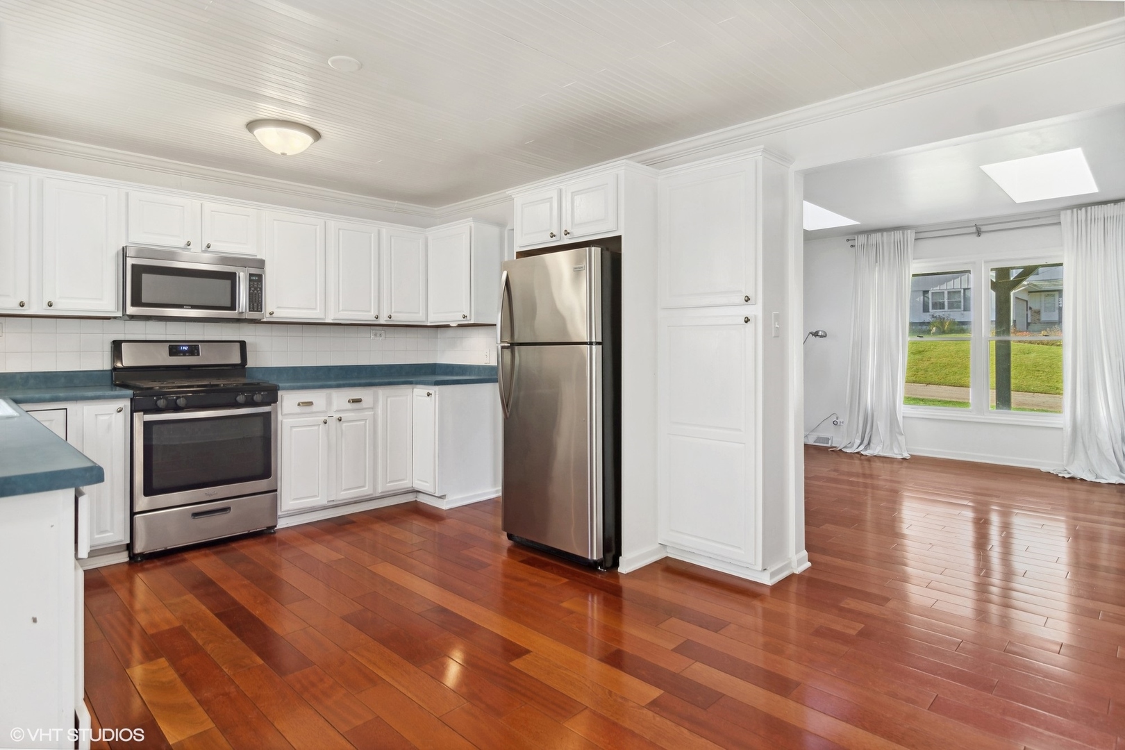 245 Thomas Street Cary, IL 60013 - Photo 7 of 28 a kitchen with granite countertop a refrigerator and a stove top oven