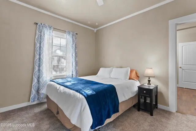 a kitchen with stainless steel appliances a refrigerator a sink dishwasher a stove and white cabinets with wooden floor