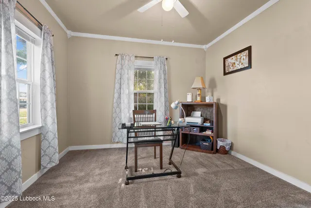 a view of a dining room with furniture and a chandelier
