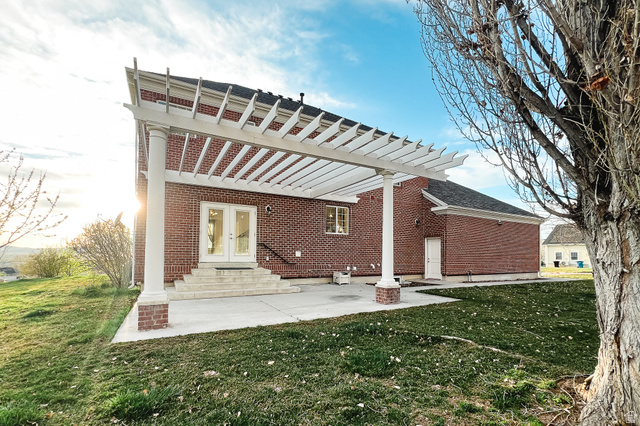 434 Cardon Ridge Drive Smithfield, UT 84335 - Photo 48 of 59 Back of property featuring a yard, a patio area, brick siding, and entry steps