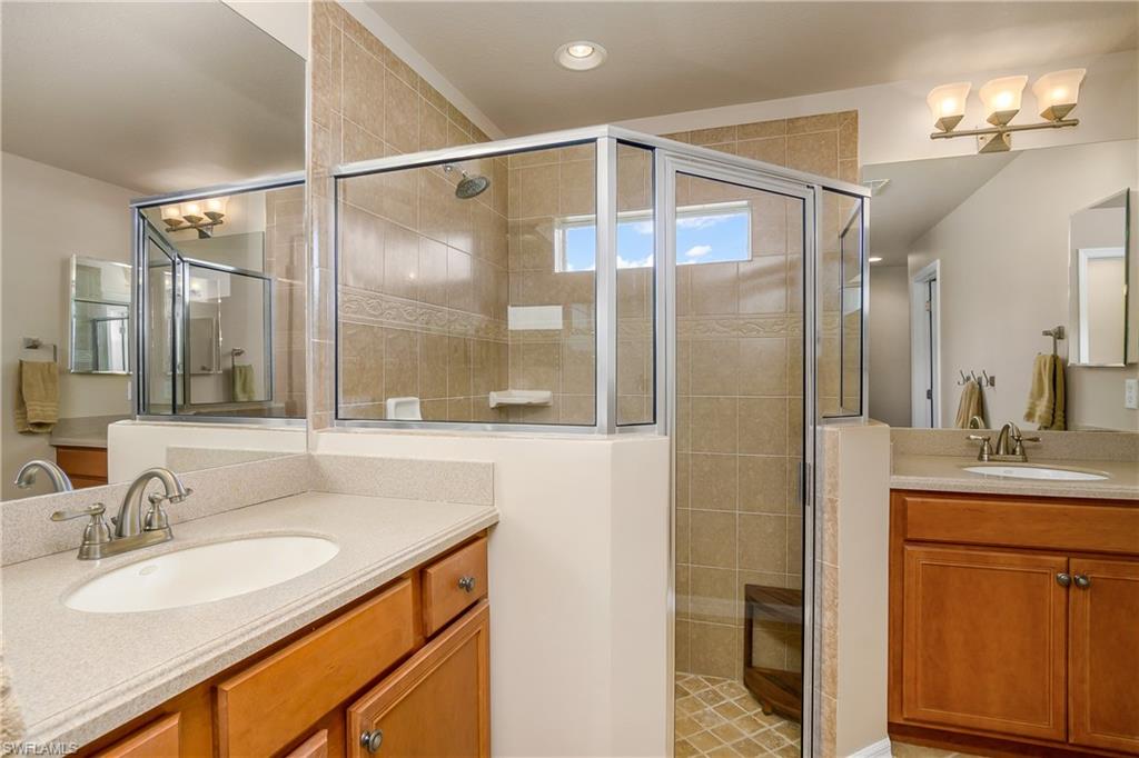 19633 Villa Rosa Loop Estero, FL 33967 - Photo 21 of 50 Bathroom with vanity and an enclosed shower
