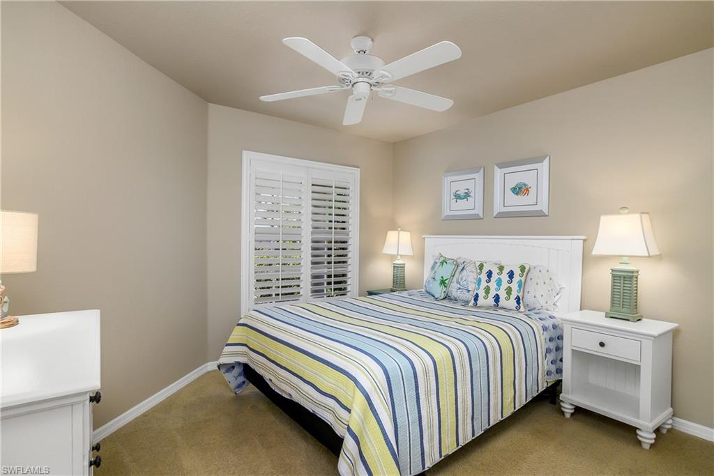 19633 Villa Rosa Loop Estero, FL 33967 - Photo 22 of 50 Carpeted bedroom with ceiling fan