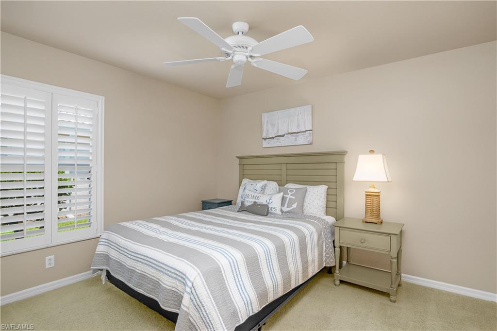 19633 Villa Rosa Loop Estero, FL 33967 - Photo 24 of 50 Carpeted bedroom with ceiling fan