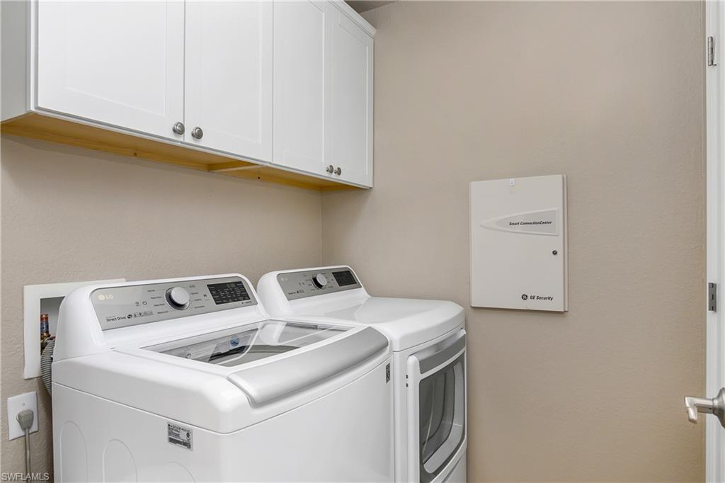 19633 Villa Rosa Loop Estero, FL 33967 - Photo 25 of 50 Washroom featuring cabinets and separate washer and dryer
