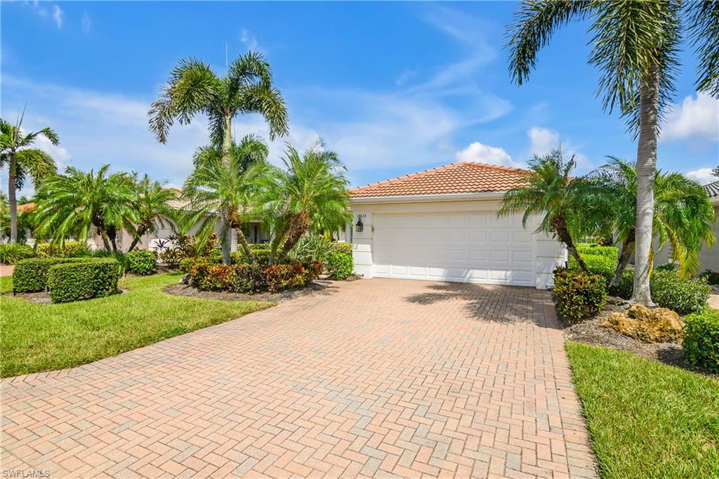 19633 Villa Rosa Loop Estero, FL 33967 - Photo 3 of 50 View of front of house with a garage and a front yard
