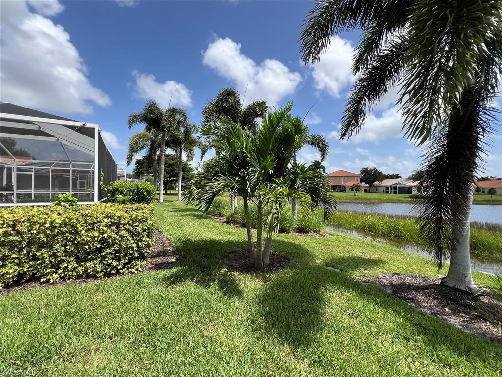 19633 Villa Rosa Loop Estero, FL 33967 - Photo 34 of 50 View of yard featuring a water view and glass enclosure
