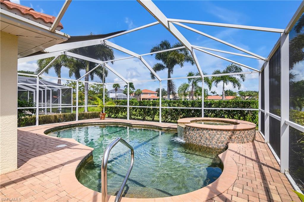 19633 Villa Rosa Loop Estero, FL 33967 - Photo 6 of 50 View of pool featuring a patio, glass enclosure, and an in ground hot tub