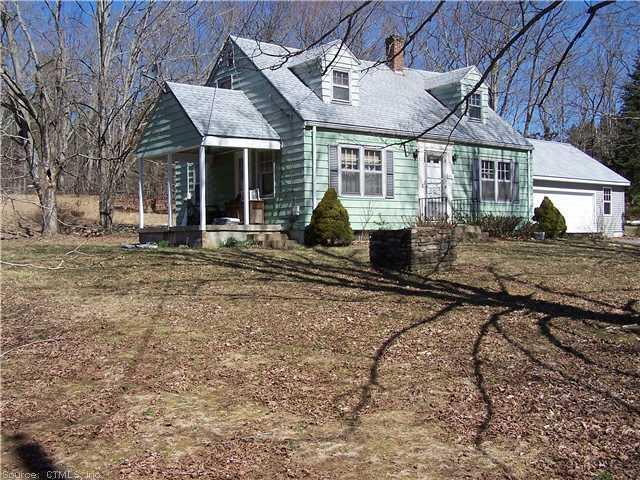 929 Warrenville Road Mansfield, CT 06250 - Photo 1 of 1 a front view of a house with a yard