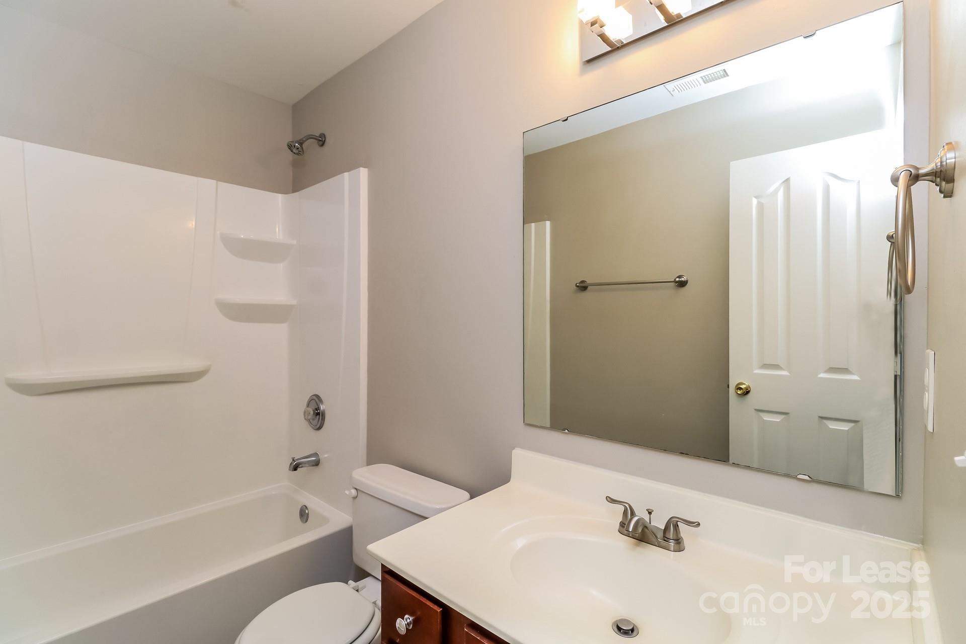 10901 Slalom Hill Road Charlotte, NC 28278 - Photo 12 of 17 a bathroom with a sink and a mirror