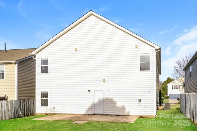 a view of a house with a yard and garage