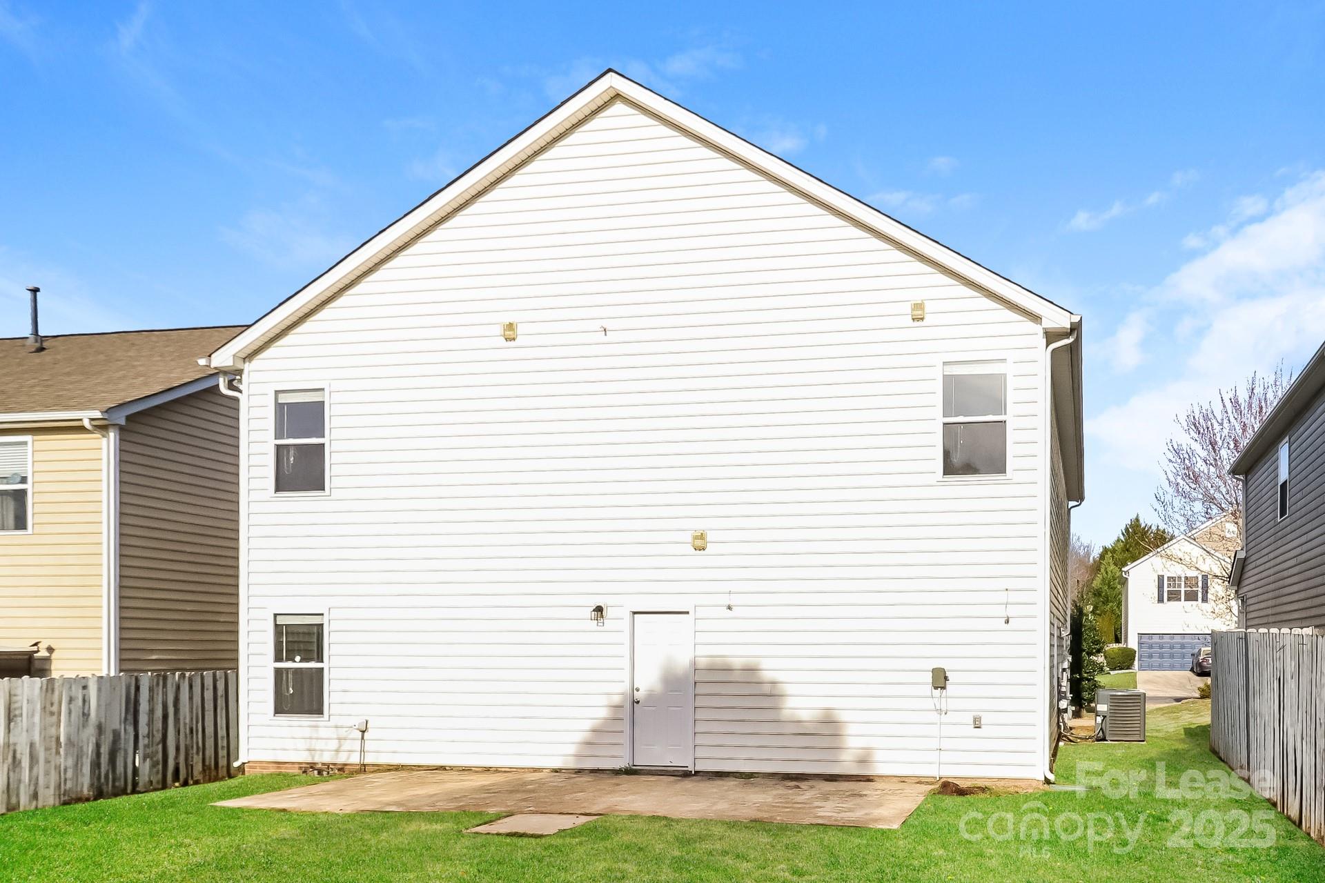 10901 Slalom Hill Road Charlotte, NC 28278 - Photo 15 of 17 a view of a house with a yard and garage
