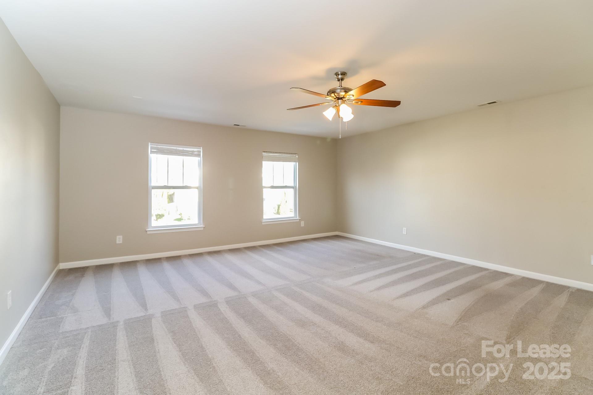 10901 Slalom Hill Road Charlotte, NC 28278 - Photo 7 of 17 a view of an empty room with a window