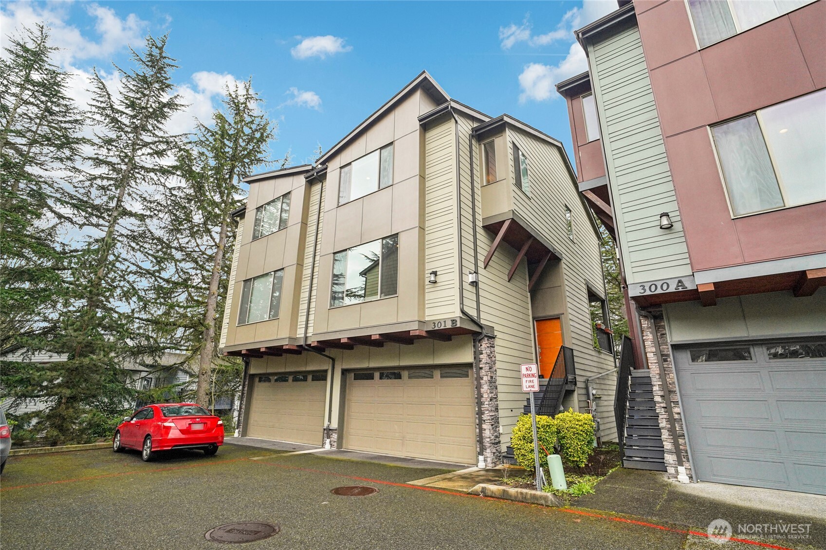 301 South 47th Street, Unit B Renton, WA 98055 - Photo 1 of 32 a front view of a house with parking