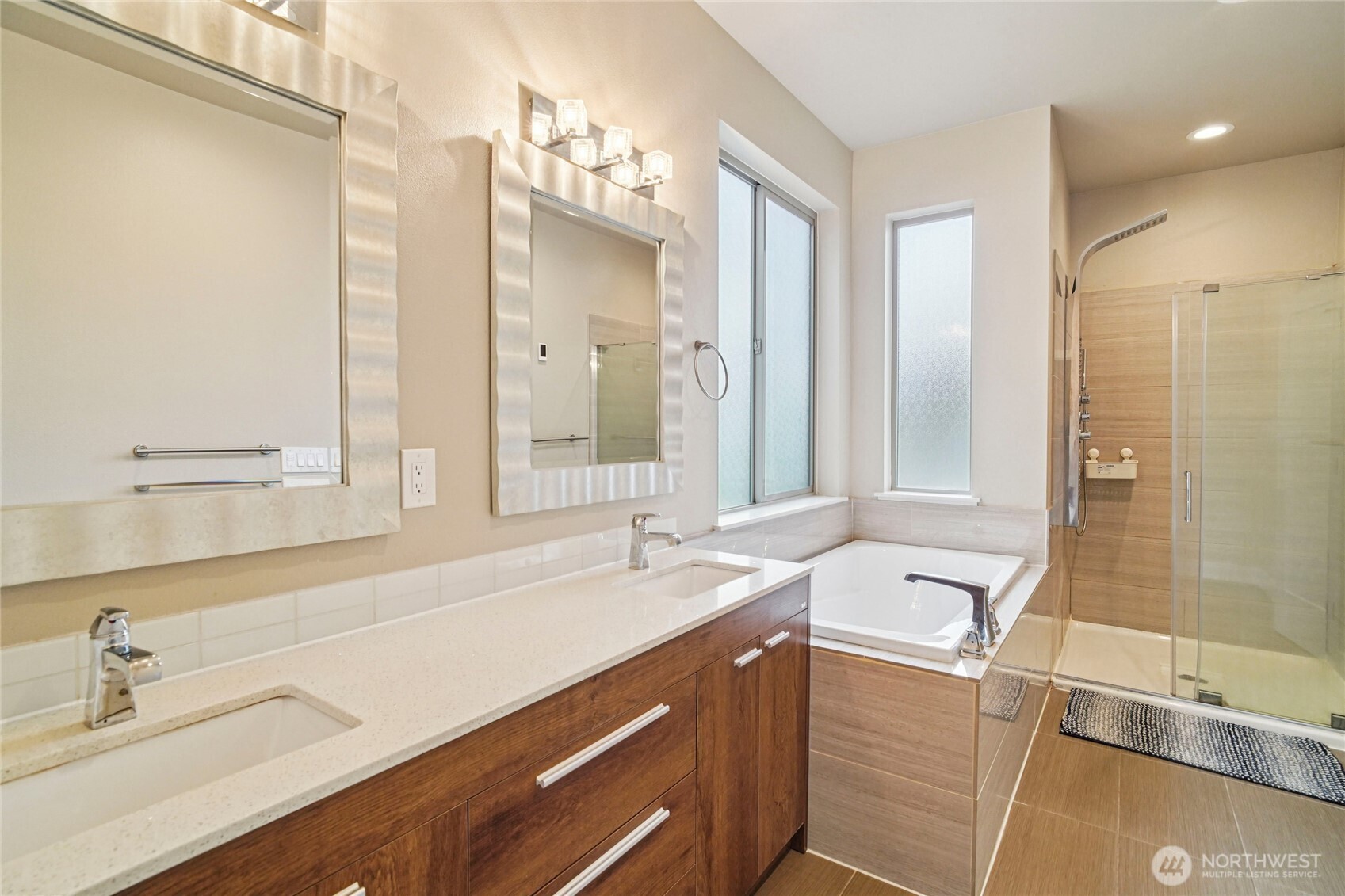 301 South 47th Street, Unit B Renton, WA 98055 - Photo 18 of 32 a bathroom with a tub sink and mirror