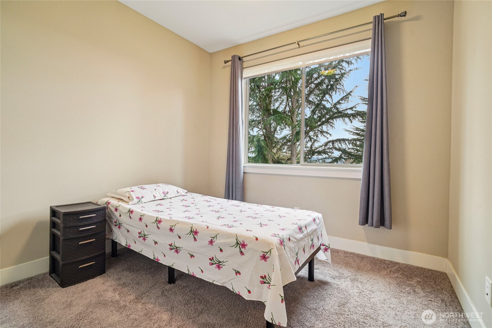 301 South 47th Street, Unit B Renton, WA 98055 - Photo 21 of 32 a bedroom with a bed and a window