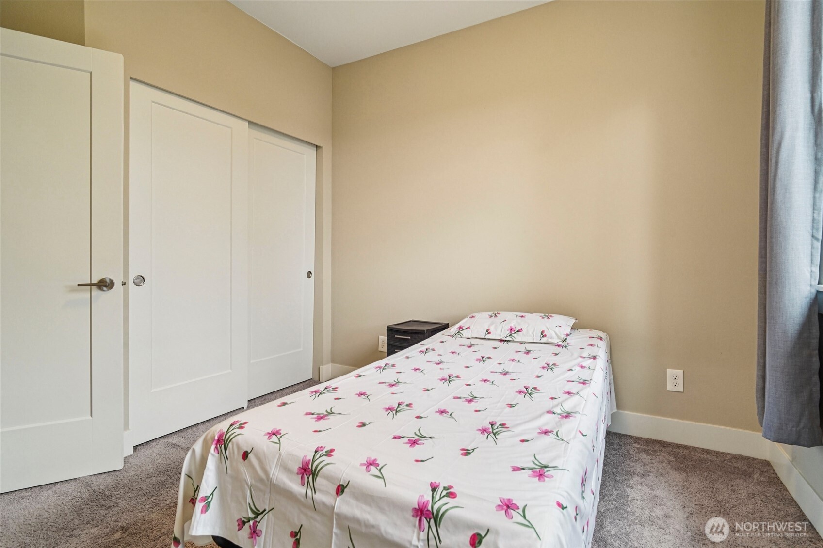 301 South 47th Street, Unit B Renton, WA 98055 - Photo 22 of 32 a bedroom with a bed and a cabinet