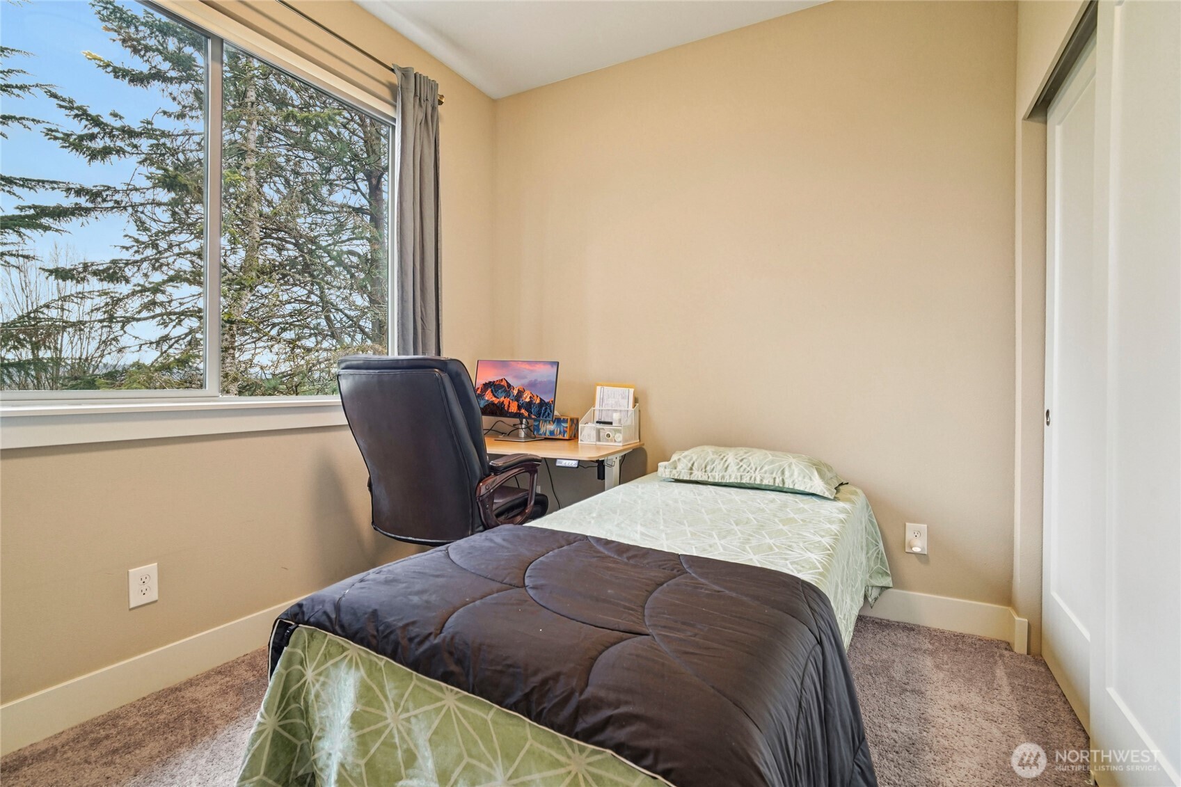 301 South 47th Street, Unit B Renton, WA 98055 - Photo 23 of 32 a bedroom with a bed and wooden floor