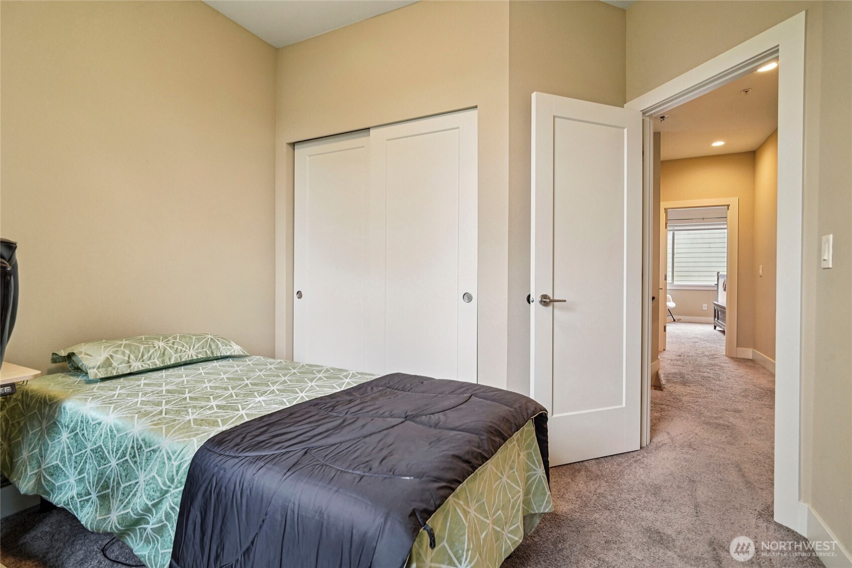 301 South 47th Street, Unit B Renton, WA 98055 - Photo 24 of 32 a bedroom with a bed and a mirror