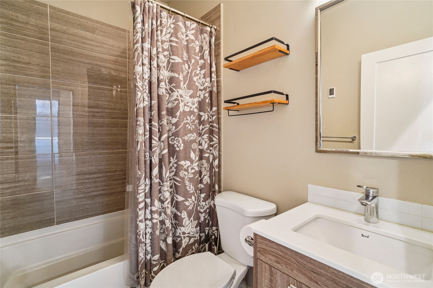 301 South 47th Street, Unit B Renton, WA 98055 - Photo 25 of 32 a bathroom with a sink toilet and shower