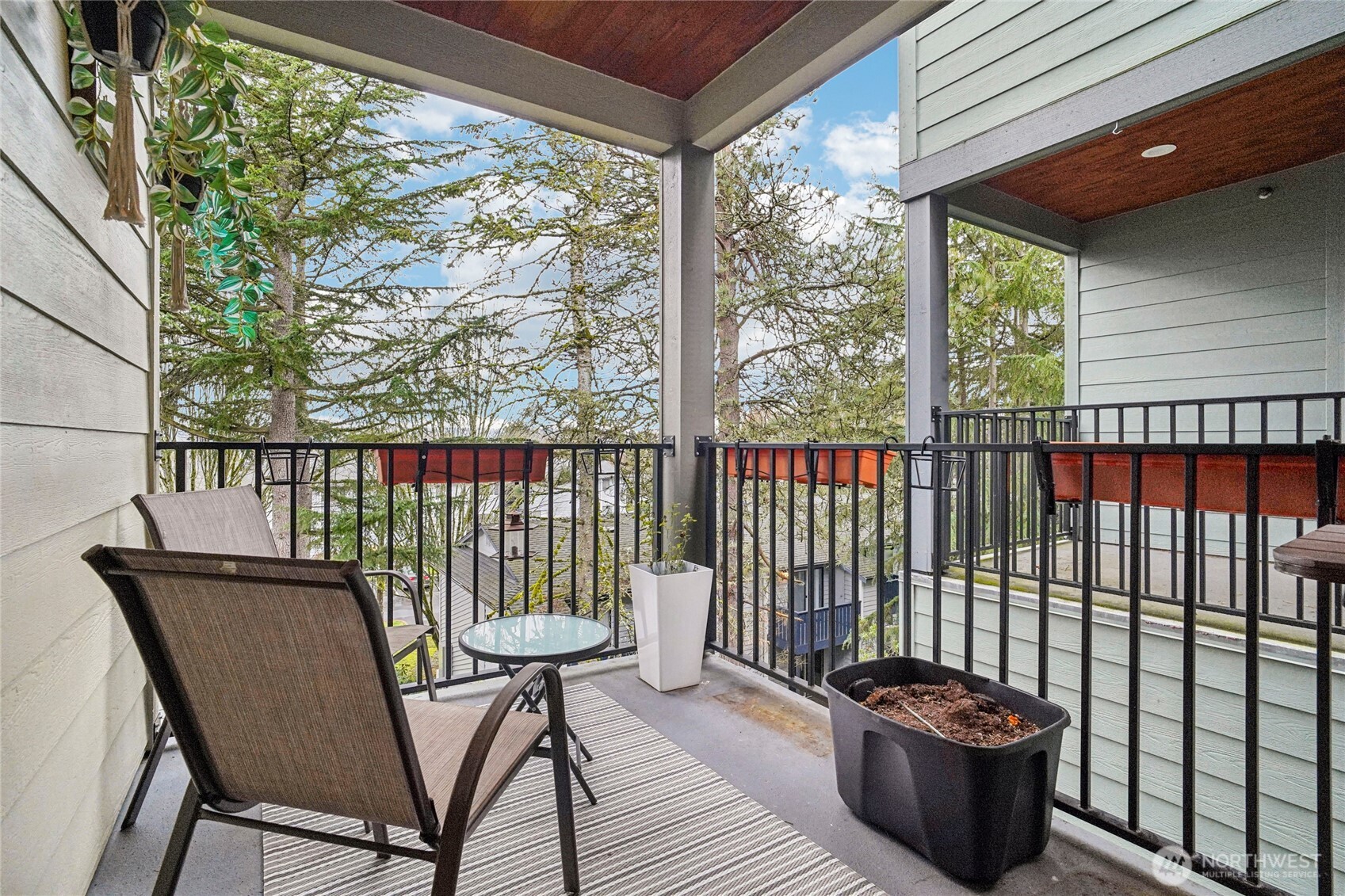 301 South 47th Street, Unit B Renton, WA 98055 - Photo 29 of 32 a view of a chair and table in the balcony