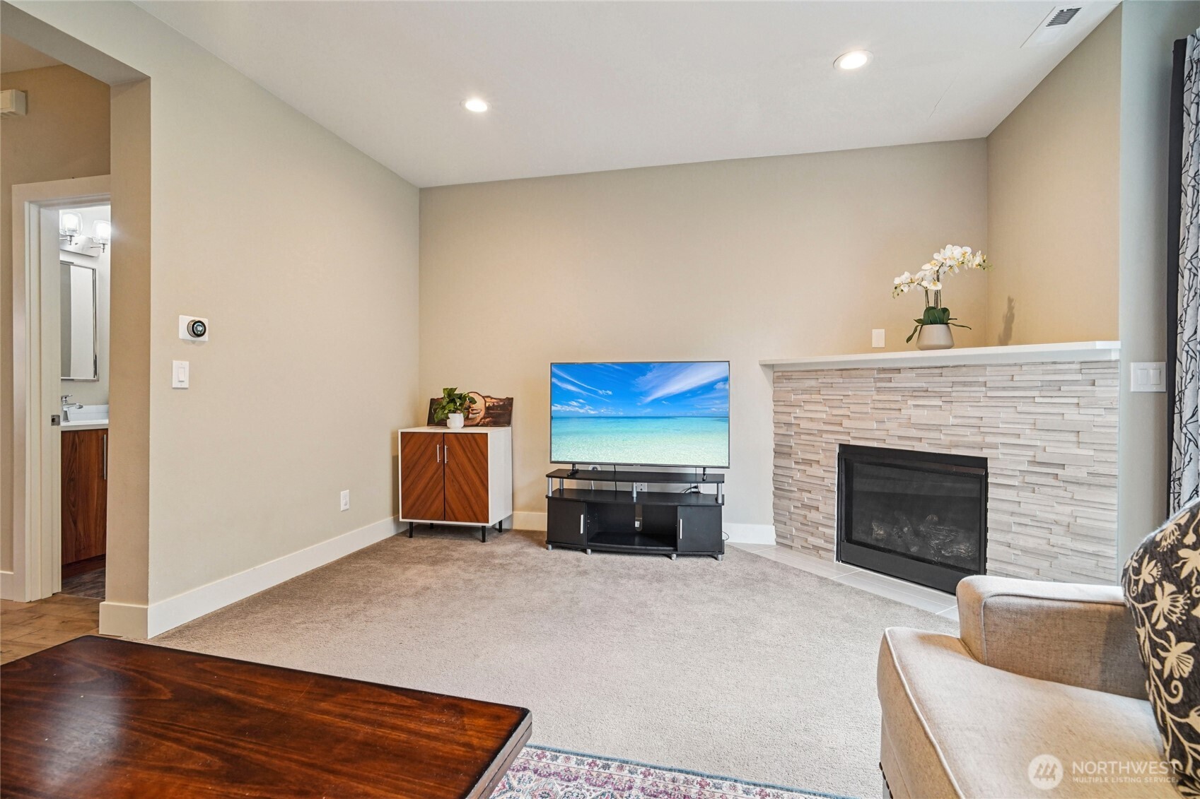 301 South 47th Street, Unit B Renton, WA 98055 - Photo 6 of 32 a living room with furniture and a fireplace