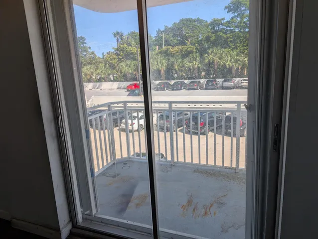 a kitchen with white cabinets and sink