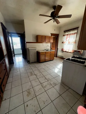 a living room with couches and flat screen tv