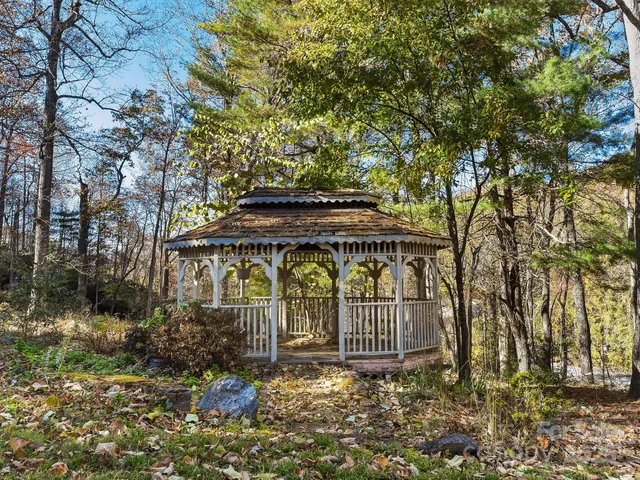 a backyard of a house with outdoor seating