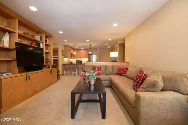 a bedroom with a bed and a night stand