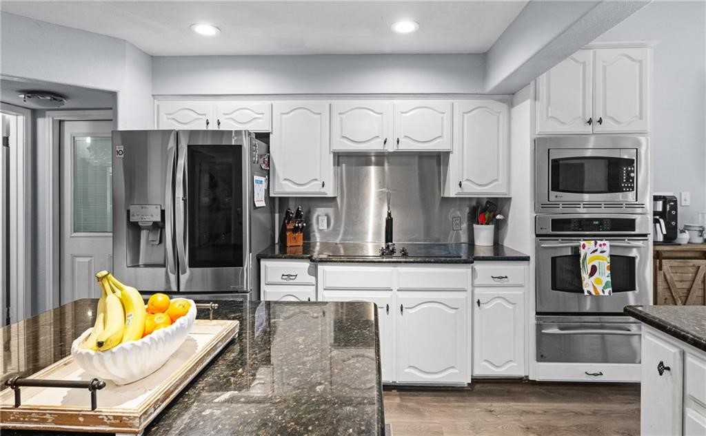5337 Inverness Drive Corpus Christi, TX 78413 - Photo 12 of 32 a kitchen with stainless steel appliances granite countertop a refrigerator and cabinets