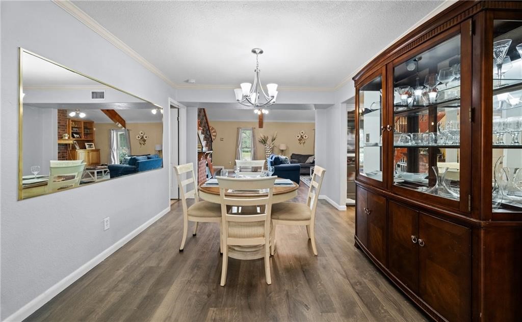 5337 Inverness Drive Corpus Christi, TX 78413 - Photo 13 of 32 a kitchen with a table chairs refrigerator and cabinets