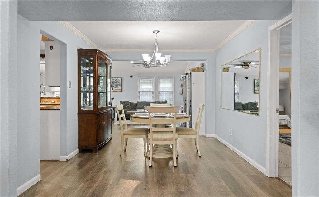 5337 Inverness Drive Corpus Christi, TX 78413 - Photo 14 of 32 a view of a dining room with furniture and wooden floor
