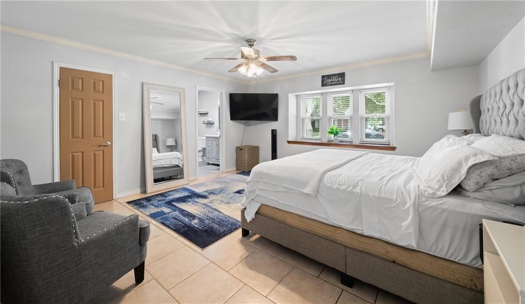 5337 Inverness Drive Corpus Christi, TX 78413 - Photo 16 of 32 a bed room with a bed a television and a window