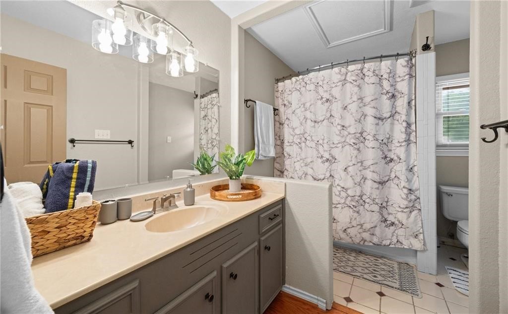 5337 Inverness Drive Corpus Christi, TX 78413 - Photo 18 of 32 a bathroom with a granite countertop sink a mirror and shower