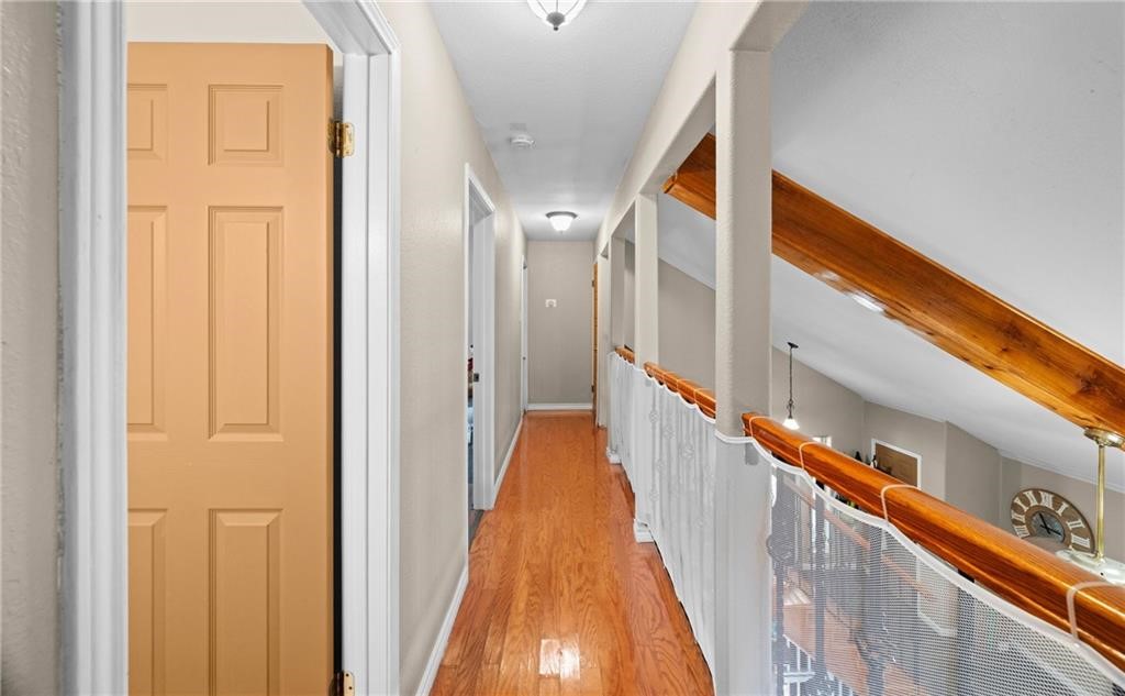 5337 Inverness Drive Corpus Christi, TX 78413 - Photo 19 of 32 a view of a hallway with wooden floor and staircase