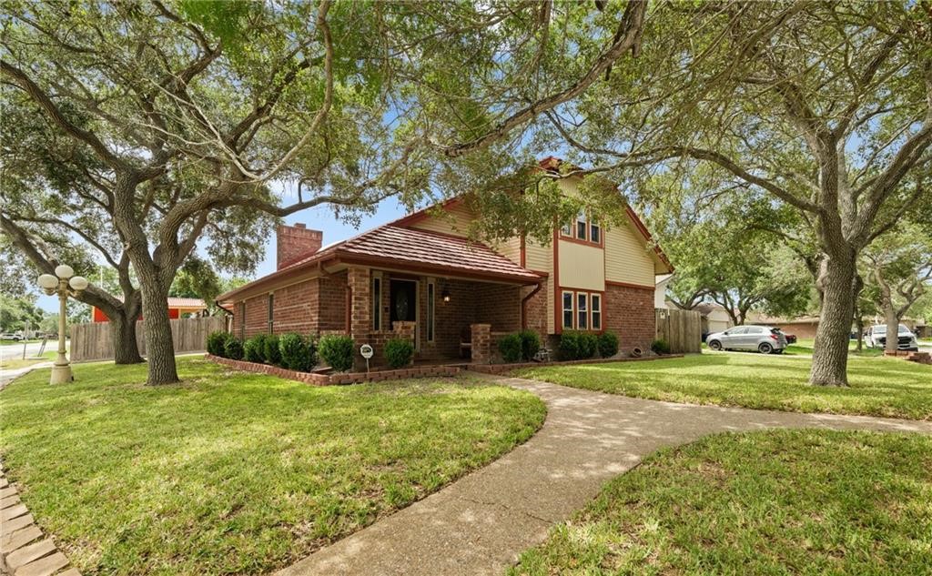 5337 Inverness Drive Corpus Christi, TX 78413 - Photo 2 of 32 a front view of a house with a yard