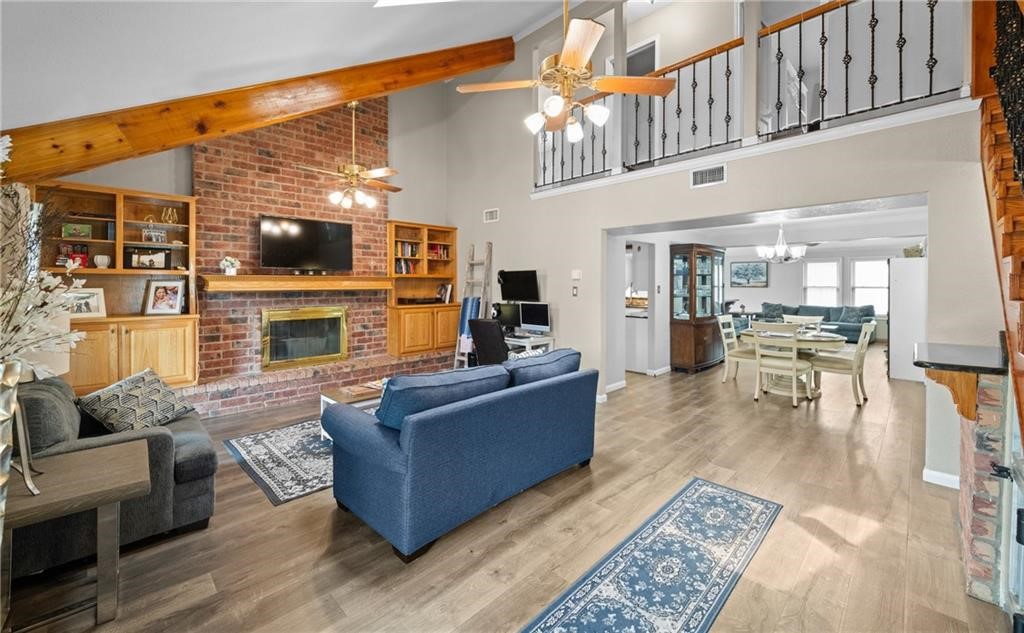 5337 Inverness Drive Corpus Christi, TX 78413 - Photo 5 of 32 a living room with furniture a flat screen tv and a fireplace