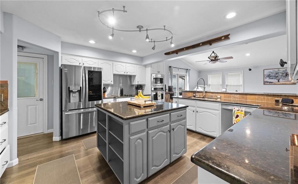 5337 Inverness Drive Corpus Christi, TX 78413 - Photo 10 of 32 a kitchen with stainless steel appliances granite countertop a sink and refrigerator