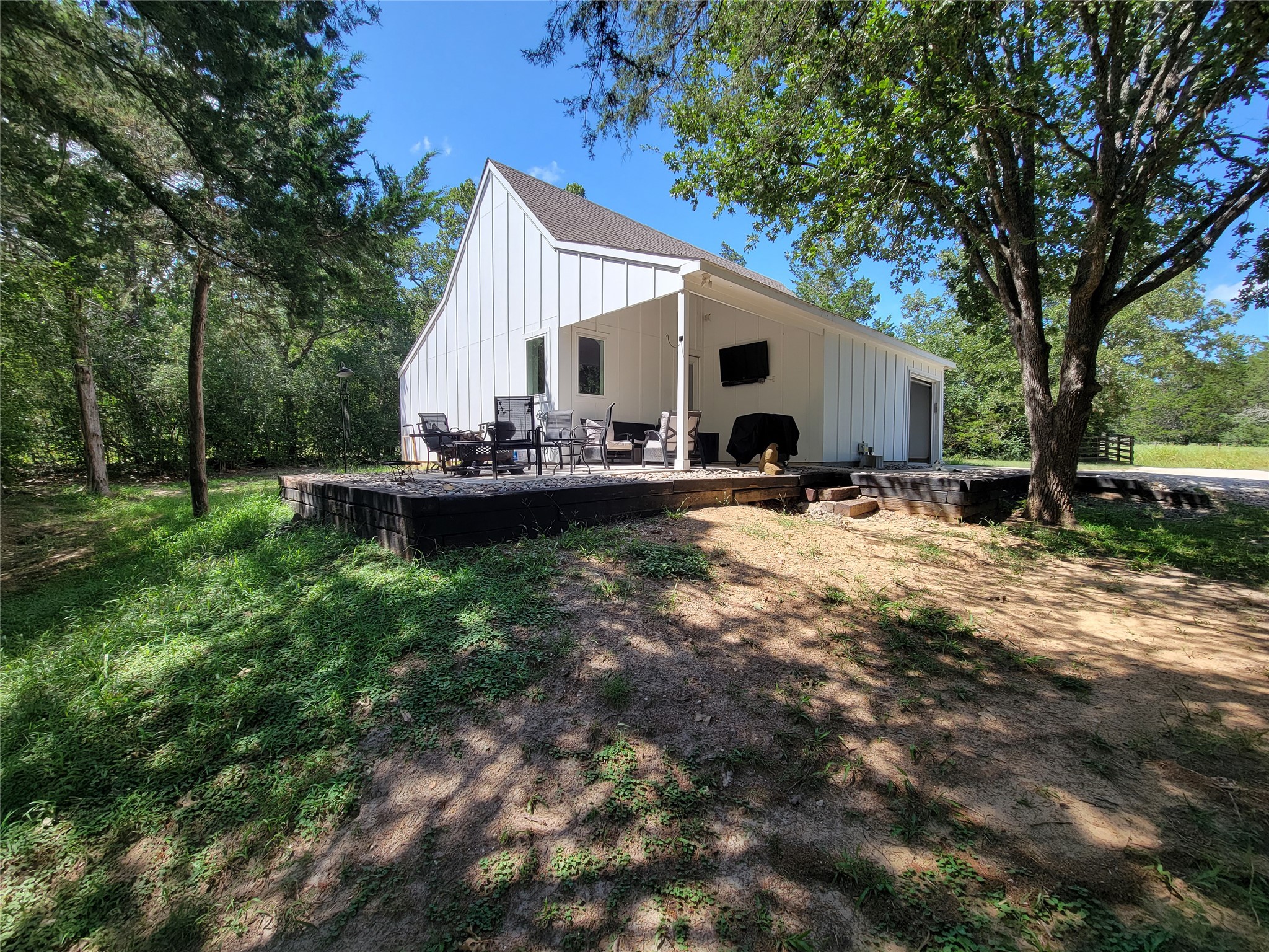 4937 Wolff Road Round Top, TX 78954 - Photo 5 of 31 Enjoy stunning vistas from the inviting covered front patio.